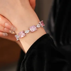 Luxury zircon bracelet featuring square pink stones and silver finish on female wrist