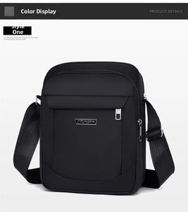 Close-up of black waterproof crossbody bag featuring multiple zipper pockets and metal logo