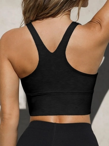 Detail view of the black sports yoga vest featuring a breathable racerback design