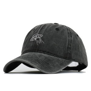 Classic washed black cotton baseball cap featuring white UFO embroidery on front panel