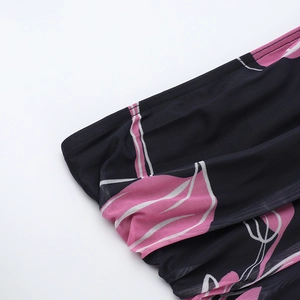 Detail of ruched mesh fabric with pink floral print and delicate seam stitching
