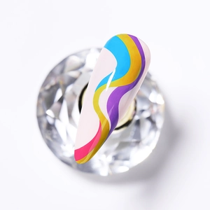 Detail view of long nail tip with 3D colorful wave patterns on a crystal base