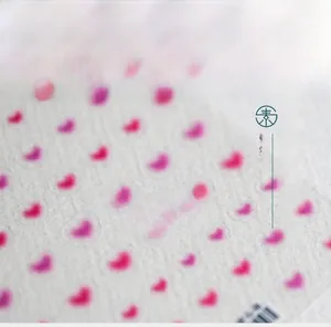 Macro detail of 5D pink heart nail stickers with gradient finish and honeycomb texture