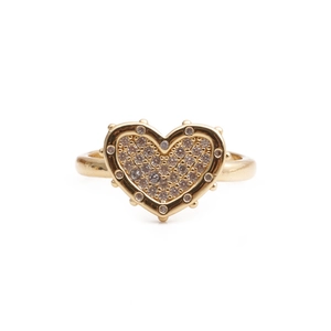 Close-up of gold heart ring with micro-paved clear cubic zirconia and beaded edges