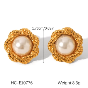 Detailed view of flower stud earrings with twisted gold frame and pearl, measuring 1.76cm