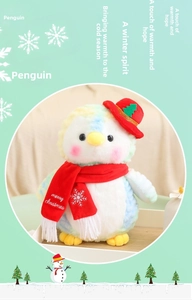 Detailed view of plush Christmas penguin with festive red hat and knitted scarf decoration
