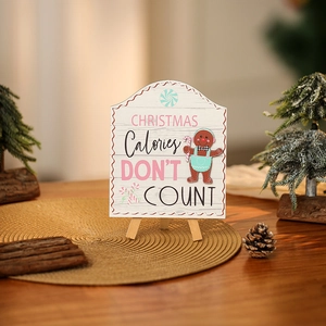 Christmas Calories Don't Count gingerbread man wooden sign on a gold placemat