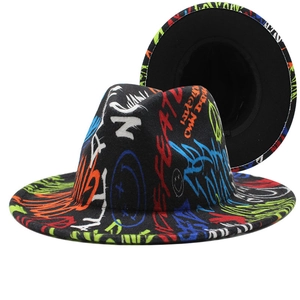Detailed close-up of a black fedora hat featuring vibrant multi-colored graffiti prints