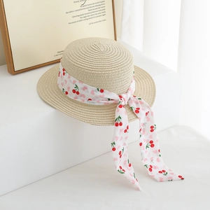 Flat top straw hat for children featuring cherry print ribbon and large elegant bow