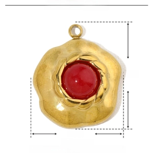 Detailed view of red natural stone pendant in gold stainless steel flower base