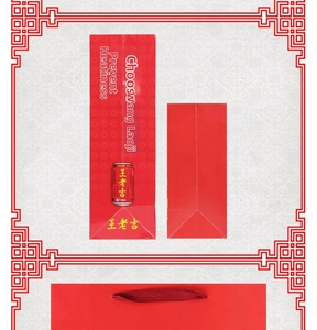 Detail of red festive paper gift bag with rope handles and ethnic brand printing