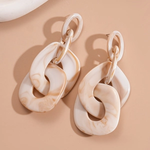 Detail of tortoiseshell acrylic chain earrings with three interlocking oval links