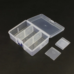 Macro detail of transparent plastic storage box with adjustable dividers and compartments