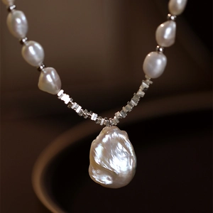 Baroque pearl necklace with vintage metal beads and an irregular drop pendant for women