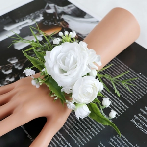 Elegant white artificial rose wrist corsage for weddings with green leaves and elastic band