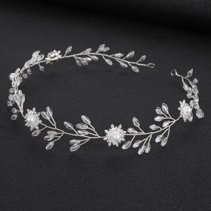 Elegant bridal headband with crystal flowers and white pearls on silver wire design