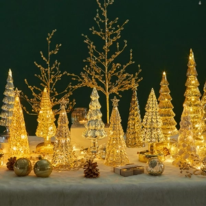 Lighted glass Christmas tree ornaments with warm LED lights and assorted textures