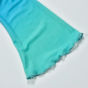 Detail of blue gradient mesh fabric with lettuce hem edges and lightweight texture