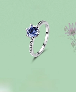 Macro detail of S925 silver ring featuring round tanzanite blue zircon and six-prong setting