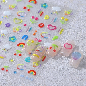 3D embossed nail stickers featuring colorful hand-drawn cherry, tulip, and rainbow motifs