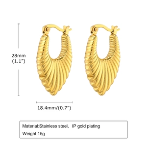 Detail showing 18K gold plated stainless steel earrings with shell texture and 28mm dimensions