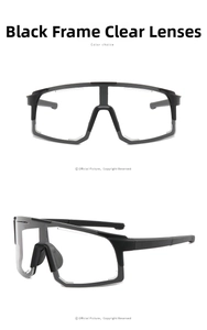 Detail view of black sports cycling glasses with large transparent lenses and silver trim