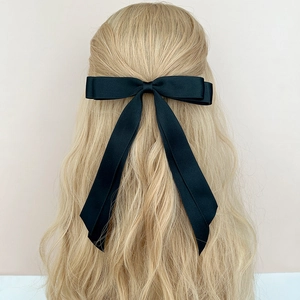 Elegant large black satin double bow hair clip with long ribbons for back styling