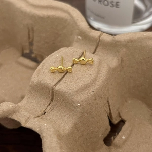 Minimalist 925 silver candy-shaped gold stud earrings with a polished mirror finish