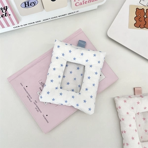 Close-up of quilted star pattern card holder with lanyard loop for photos