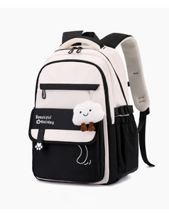 Close-up of lightweight waterproof school backpack with padded straps and cloud charm