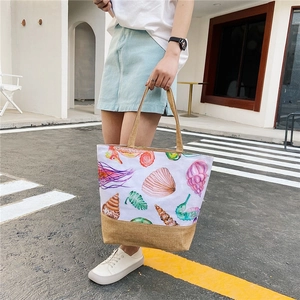 Linen canvas tote bag with sea life patterns for women shown in an urban street setting