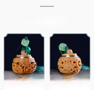 Detailed view of hollowed sandalwood sachets with green beads and long tassels