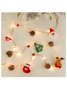 Close-up of LED Christmas string lights with Santa, reindeer, and pine cone ornaments