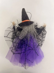 Rear view of Halloween witch doll with black and purple fabric details and hanging rope