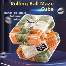 Macro view of a 3D gravity maze cube puzzle with internal steel ball and colorful paths