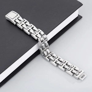 Sleek stainless steel H-link chain bracelet for men with industrial design on black book
