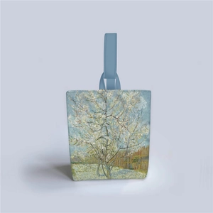 Close-up of Van Gogh Almond Blossoms oil painting print on a light blue canvas bucket bag