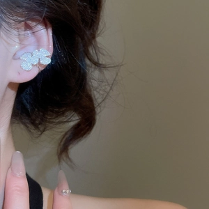 Silver zircon petal ear bone cuff shown on model for an elegant luxury style