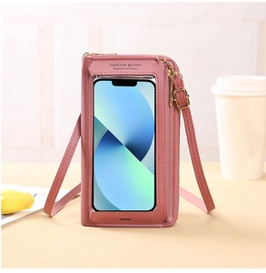 Pink crossbody phone bag with a transparent touch screen window and metal zipper details