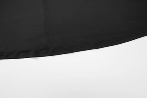 Detailed close-up of a black dress hem featuring professional double-needle stitching