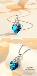 Detailed macro view of S925 sterling silver heart necklace with blue crystal and micro-pavé