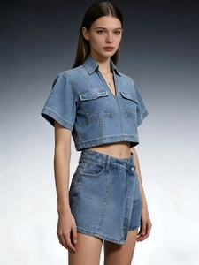 Women's light blue washed denim set with short sleeve crop top and asymmetric mini skirt