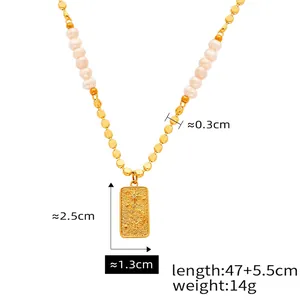 Detail of tiger eye stone necklace with gold pendant and white freshwater pearls