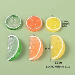 Detailed macro view of resin citrus slices in lime green, orange, and lemon yellow colors