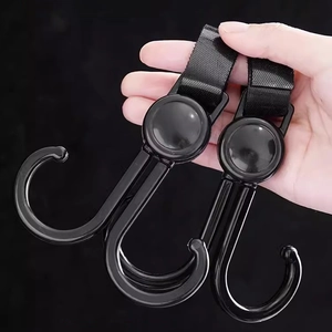 Universal black stroller and bike hook with adjustable nylon velcro strap for versatile storage