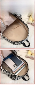 Internal view of leopard print backpack showing spacious main compartment and pockets