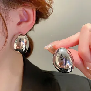 Minimalist silver mirror polished oval drop earrings with sleek geometric metallic design