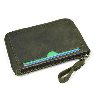 Detail of dark olive green leather coin pouch with zipper and card slot storage