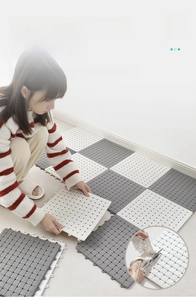 Detail of TPE anti-slip bath mat showing snap-lock modular design and DIY trimming process