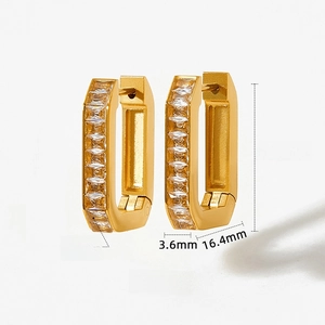 Detailed view of gold hoop earrings with baguette zircon stones and size measurements
